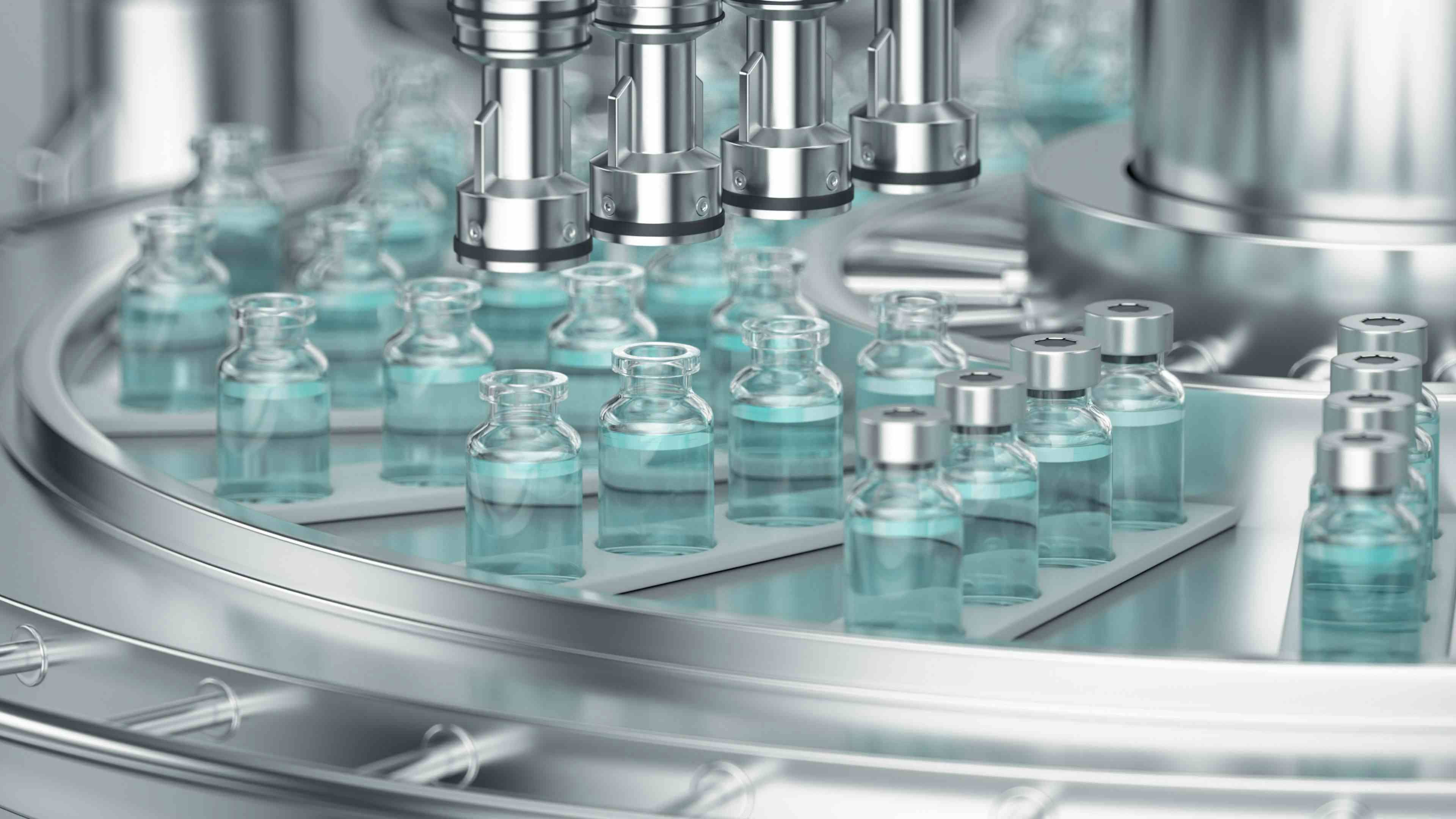 Pharmaceutical manufacture background with glass bottles with clear liquid on automatic conveyor line. | Image Credit: wacomka - stock.adobe.com